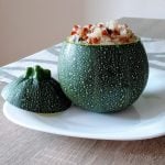 Round zucchini filled with quinoa and lentils