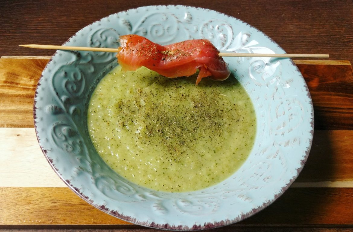 Green soup with dill and smoked salmon skewer