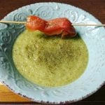 Green soup with dill and smoked salmon skewer